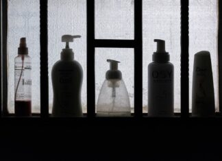 HERMIT 3 bottles on black wooden shelf