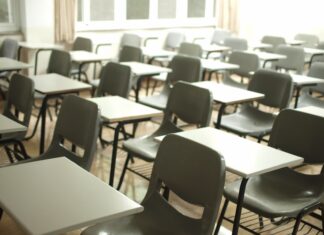 MY HIGH SCHOOL CREATIVE WRITING TEACHER white table with black chairs