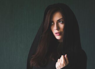 mystique woman in black long sleeve shirt