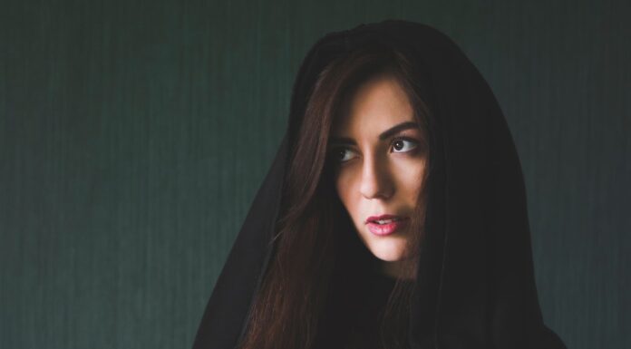 mystique woman in black long sleeve shirt