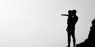 Show and Tell silhouette of man carrying child