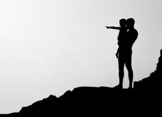 Show and Tell silhouette of man carrying child