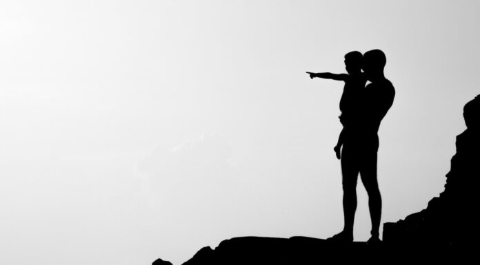 Show and Tell silhouette of man carrying child