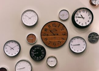 Writing Poems for Gullible Readers white and brown analog wall clock at 10 00