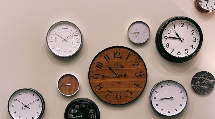 Writing Poems for Gullible Readers white and brown analog wall clock at 10 00