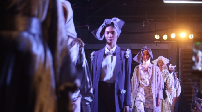 best forum poetry group of women wearing dresses in a fashion show