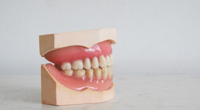 Antediluvian brown cardboard box with white and red round medication pills