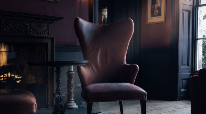 the floor boards ask questions brown fabric seat near brown wooden pedestal table