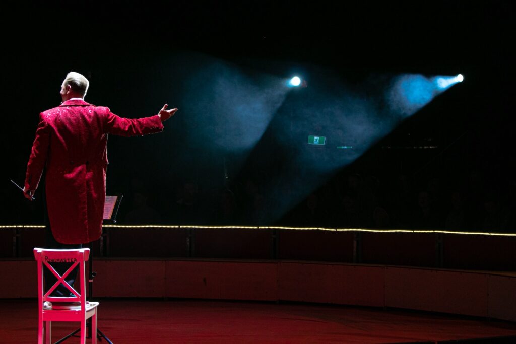 the ringmaster never takes off his hat