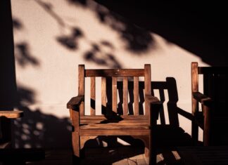 Death Did Us Part brown wooden armchairs near wall