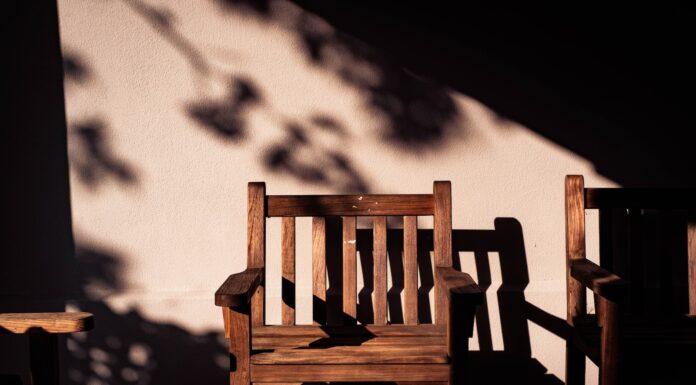 Death Did Us Part brown wooden armchairs near wall