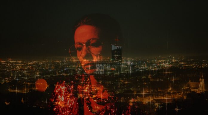 EVERYWHERE woman reflection on glass overlooking city at night