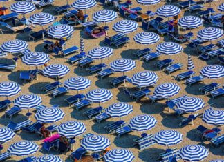 heretical thoughts on a hot day aerial photography of blue-and-white patio umbrellas