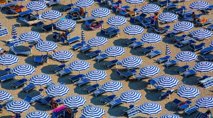 heretical thoughts on a hot day aerial photography of blue-and-white patio umbrellas