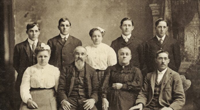 Verities a group of people posing for a photo