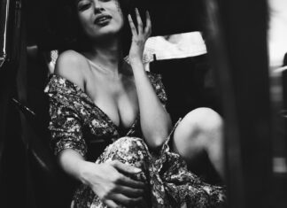 Every Play woman inside black car