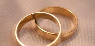 After her best friend’s hubby’s funeral gold ring on white textile
