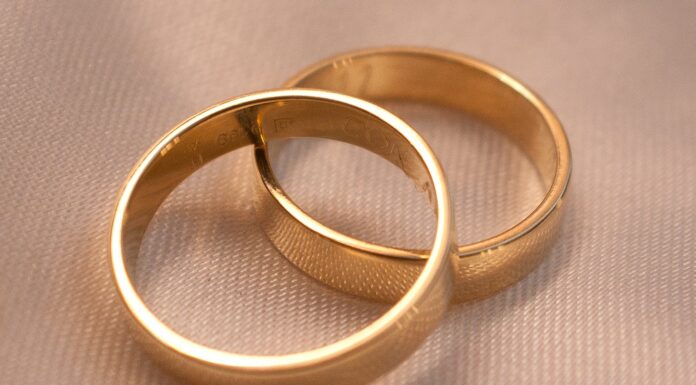 After her best friend’s hubby’s funeral gold ring on white textile