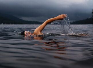 Fuck Yeah Dude man swimming on body of water