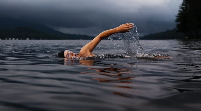 Fuck Yeah Dude man swimming on body of water
