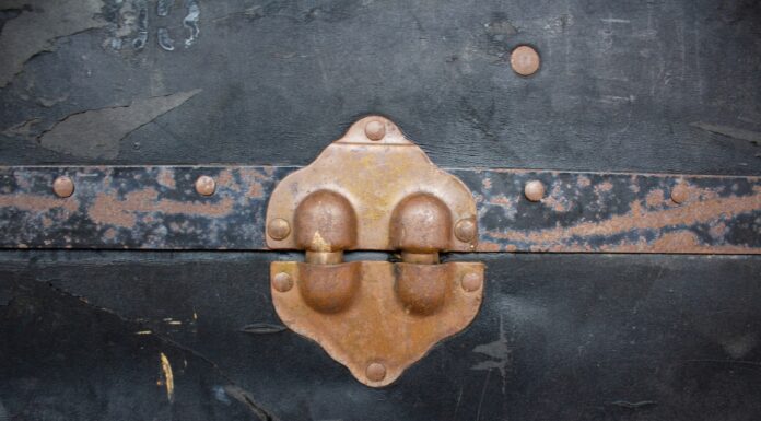 blood on a wedding dress gold steel door knob on black wooden door