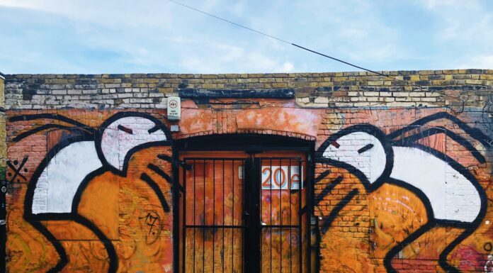 I stepped in vomit today orange and black mural wall