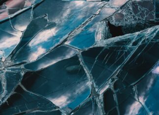 LINES MADE OF SHATTERED GLASS a close up of a broken glass window