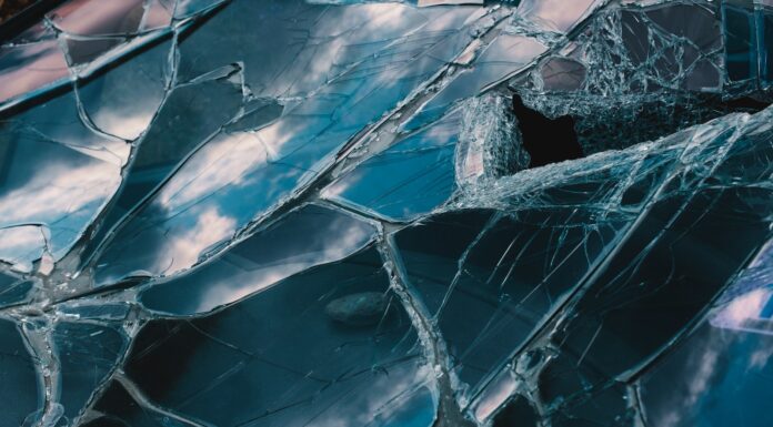 LINES MADE OF SHATTERED GLASS a close up of a broken glass window