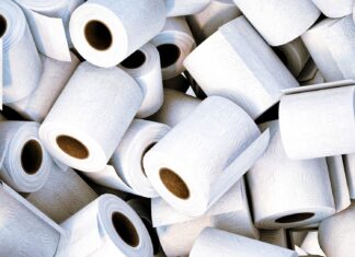 Last Call a pile of white toilet paper sitting next to each other