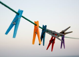 Jack Struggles with an Equation seven assorted-color clothes pegs hanging on rope