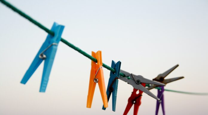 Jack Struggles with an Equation seven assorted-color clothes pegs hanging on rope