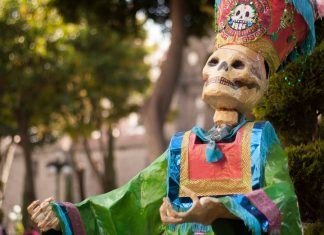 death skeleton statue near tree