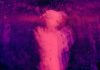spectral cannibalization a purple and black photo of a person in the dark
