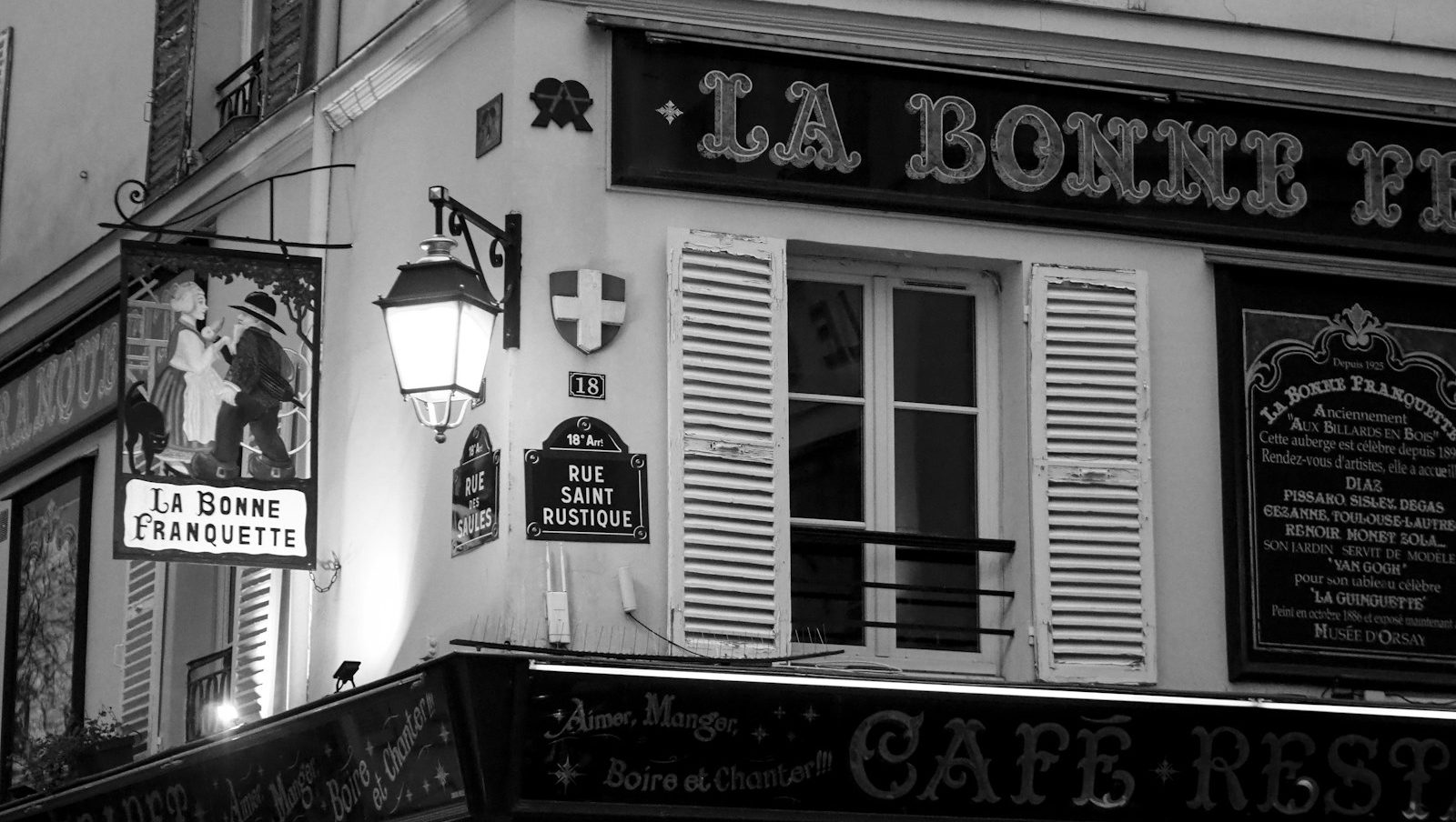 An old parisian cafe sign and building.