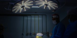 Intrusion a group of doctors in scrubs in a dark room