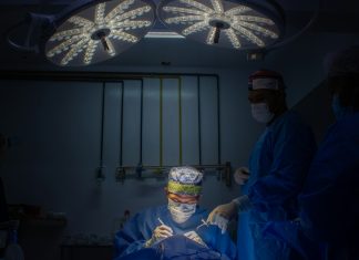 Intrusion a group of doctors in scrubs in a dark room