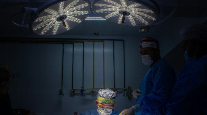 Intrusion a group of doctors in scrubs in a dark room