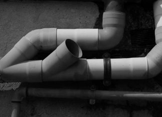 Thinkers A black and white photo of a pipe