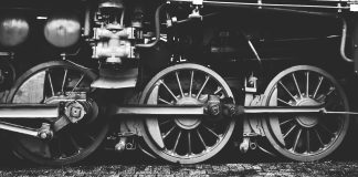 Verlaine’s Bride Boards a Train grayscale photography of train