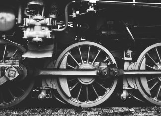 Verlaine’s Bride Boards a Train grayscale photography of train