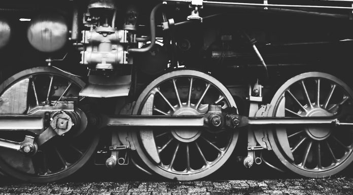Verlaine’s Bride Boards a Train grayscale photography of train